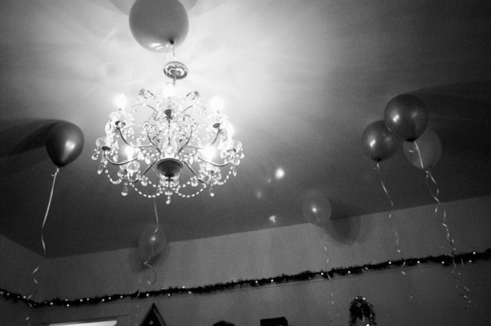 Balloons gracing the ceiling with the crystal chandelier inside my neighbor's home during their New Year's Party in Downtown Los Angeles.